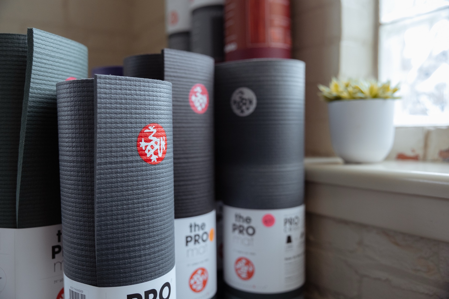 Rolled yoga mats on display