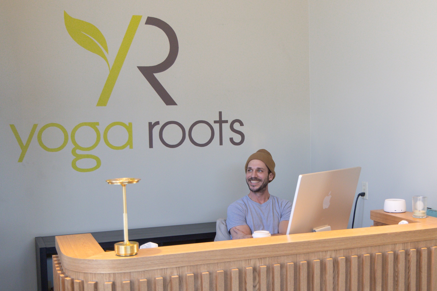 Reception area with Yoga Roots logo