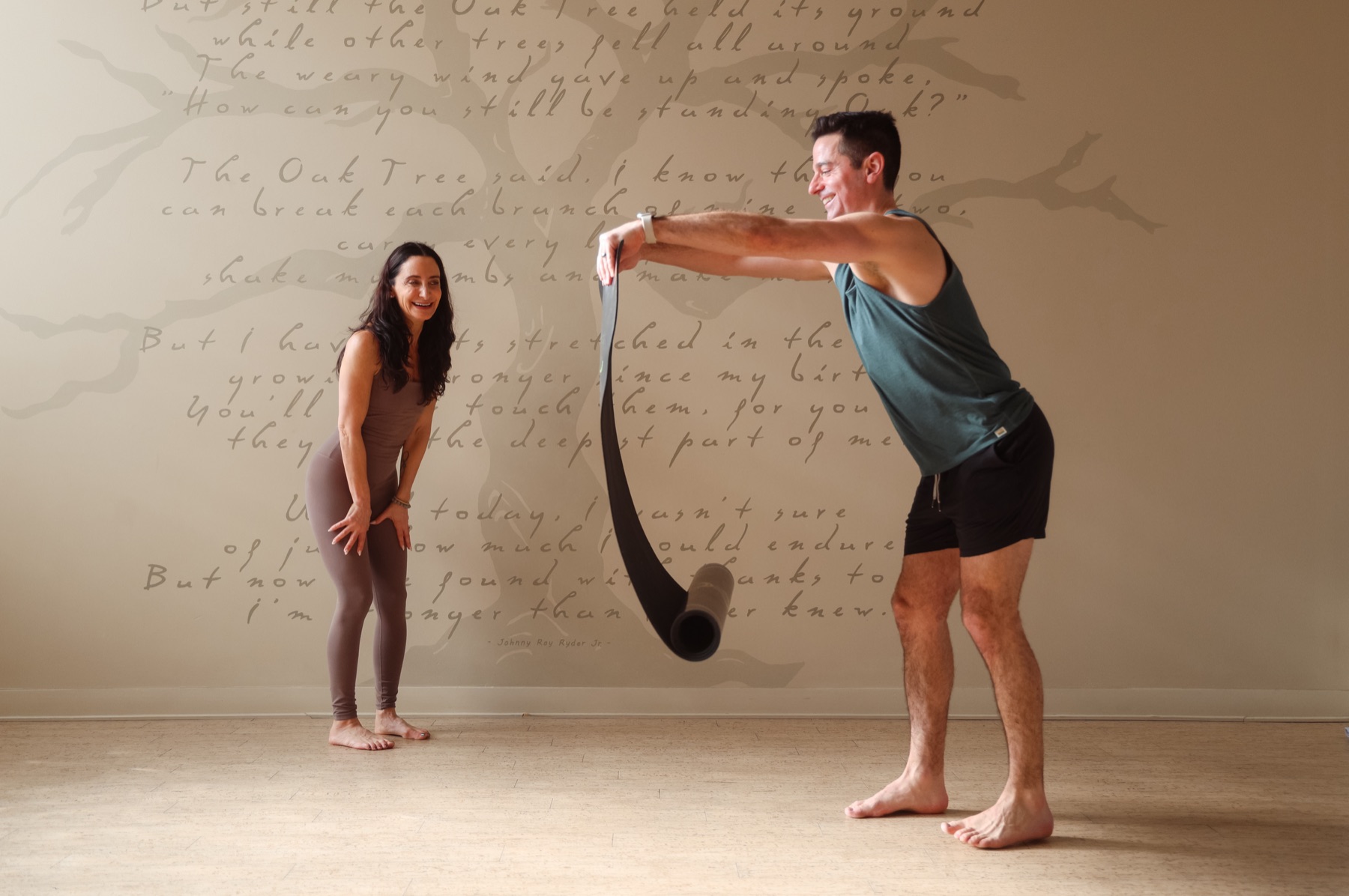 Kim and Creative Director with the poetry wall at Yoga Roots